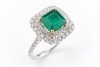 AN EMERALD AND DIAMOND DRESS RING