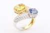 A DIAMOND AND SAPPHIRE CROSSOVER RING - 9