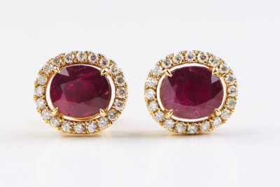 A PAIR OF RUBY AND DIAMOND STUD EARRINGS