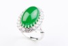 A CABOCHON JADE AND DIAMOND CLUSTER RING - 2
