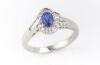 A SAPPHIRE AND DIAMOND RING