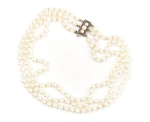 A VINTAGE TRIPLE STRAND OF AKOYA CULTURED PEARLS