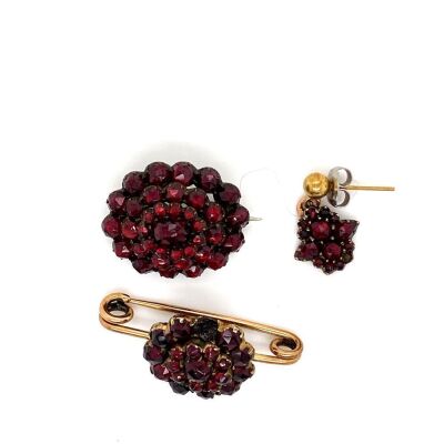 TWO GARNET SET VICTORIAN BROOCHES AND A SINGLE EARRING
