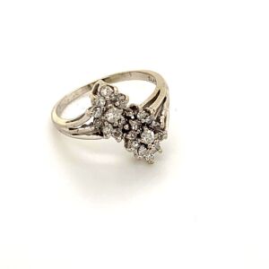 A DOUBLE DIAMOND CLUSTER CROSSOVER DRESS RING