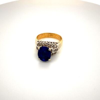 A SYNTHETIC SAPPHIRE AND DIAMOND DRESS RING