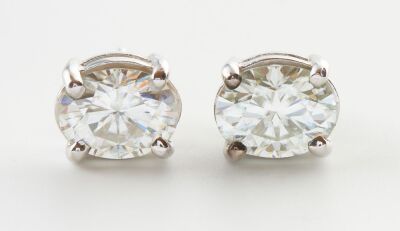 A PAIR OF MOISSANITE STUD EARRINGS