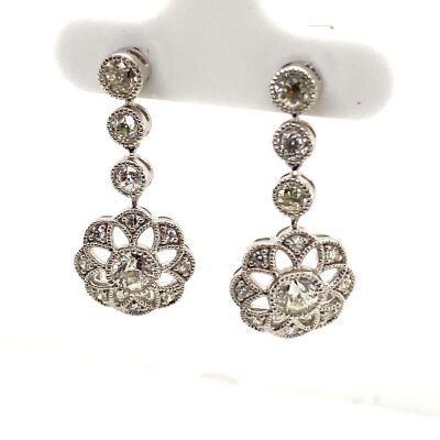 A PAIR OF DIAMOND EARRINGS