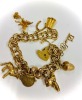 A GOLD CHARM BRACELET - 2