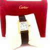 A LADIES CARTIER TANK GOLD WRISTWATCH