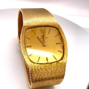 A GIRARD-PERREGAUX GOLD WRISTWATCH