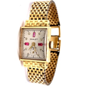 A VINTAGE LADIES GOLD CHALET SWISS WRISTWATCH