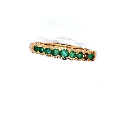 AN EMERALD DRESS RING