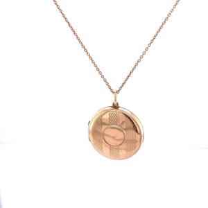 A LOCKET AND CHAIN TOGETHER WITH A PENDANT NECKLACE