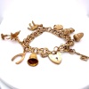 A GOLD CHARM BRACELET - 3