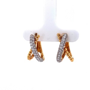 A PAIR OF DIAMOND CROSSOVER EARRINGS