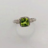 A PERIDOT AND DIAMOND RING