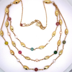 A MULTI STRAND TOURMALINE AND PEARL SET NECKLACE BY JULES COLLINS