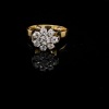 AN ANTIQUE DIAMOND FLOWER CLUSTER RING