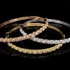 A COLOURED AND WHITE DIAMOND TRIO OF HINGED BANGLES - 2