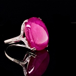 A LARGE CABOCHON RUBY RING