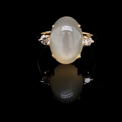 A MOONSTONE AND DIAMOND RING