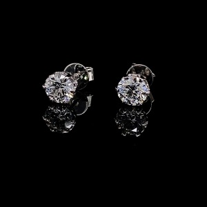 AN IMPRESSIVE PAIR OF DIAMOND STUDS