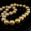 A GRADUATED STRAND OF GOLDEN SOUTH SEA PEARLS - 2