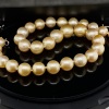 A GRADUATED STRAND OF GOLDEN SOUTH SEA PEARLS - 6