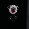 A RUBY AND DIAMOND CLUSTER RING