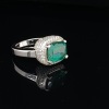 AN EMERALD AND DIAMOND RING