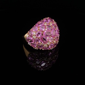 A PINK SAPPHIRE AND DIAMOND BOMBE RING