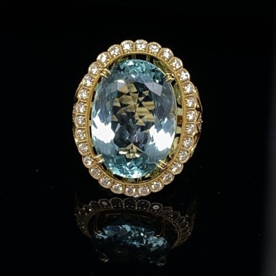 AN LARGE AQUAMARINE AND DIAMOND COCKTAIL RING