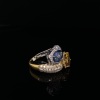 A DIAMOND AND SAPPHIRE CROSSOVER RING - 2