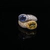 A DIAMOND AND SAPPHIRE CROSSOVER RING - 3