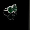 A THREE STONE EMERALD AND DIAMOND CLUSTER RING - 3