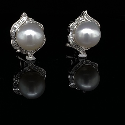 A PAIR OF PEARL AND DIAMOND EARRINGS