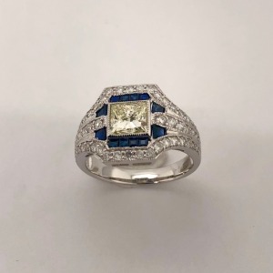 A DIAMOND AND SAPPHIRE RING