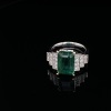 AN EMERALD AND DIAMOND DRESS RING