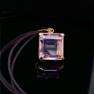 A KUNZITE ENHANCER AND NECKLET