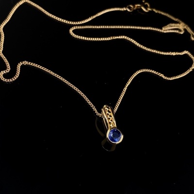 A SAPPHIRE AND DIAMOND PENDANT RETAILED BY MAPPIN AND WEBB