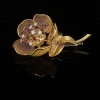 A VINTAGE FRENCH DIAMOND AND RUBY FLOWER BROOCH