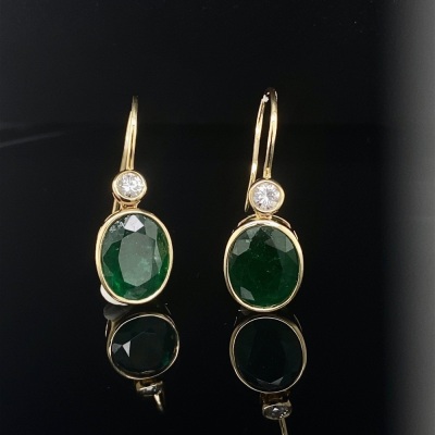 A PAIR OF EMERALD AND DIAMOND HOOK EARRINGS