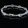 AN AQUAMARINE AND DIAMOND BRACELET - 4