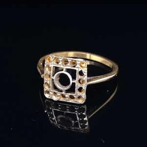 A RING MOUNT IN GOLD