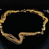 A MULTI STRAND NECKLACE IN 18CT GOLD
