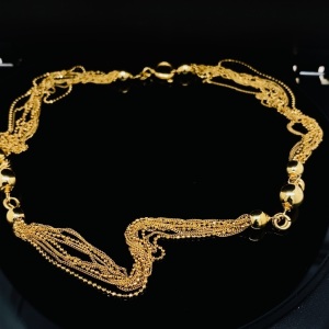 A MULTI STRAND NECKLACE IN 18CT GOLD 