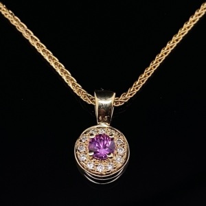 A PINK SAPPHIRE AND DIAMOND PENDANT NECKLACE