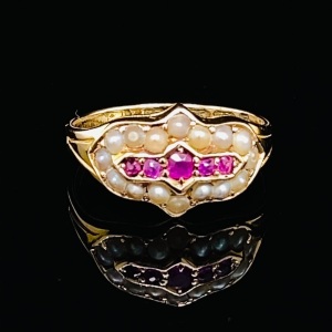 A VICTORIAN RUBY AND SEED PEARL GOLD RING