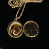 AN ANTIQUE LOCKET AND CHAIN - 2