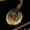 AN ANTIQUE LOCKET AND CHAIN - 3